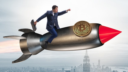 Businessman flying on rocket in bitcoin price rising concept