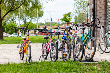 Group of bicycles in the row. Parked bicycles on sidewalk in Belgrade.