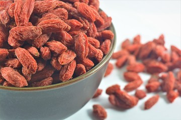 dried goji berry or wolfberry is the fruit and from china in bowl on white background
