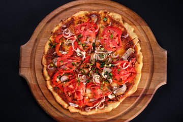 Top view gluten Free Rustic pizza with tomatoes, cheese, spices and fresh basil. Home made food. Concept for a tasty meal. Close up.