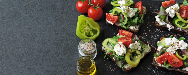 Healthy keto toasts with salad and white cheese. Open sandwiches with a mix of salads, vegetables and white cheese. Vegetarian diet. Keto diet