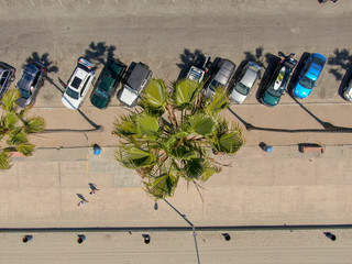 Aerial top view of parking lot with cars in front of the beach. La Jolla, San Diego, California,...