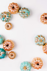 Stylish  Halloween Frame with Shiny Decorative Pumpkins. Flat lay, top view trendy holiday concept.