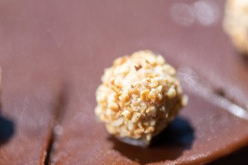 Close up of chocolate cake with nuts balls.