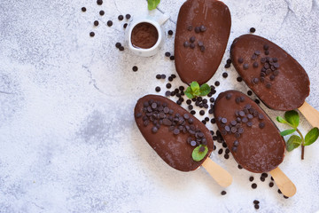 Chocolate ice-cream. Popsicle on concrete background. Top view.