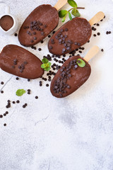 Chocolate ice-cream. Popsicle on concrete background. Top view.