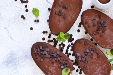 Chocolate ice-cream. Popsicle on concrete background. Top view.