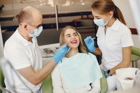 Beautiful lady in the dentist's office. Woman in a uniform