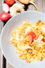 Pasta, spaghetti with cheese, mushrooms and tomato. Healthy food. Top view.
