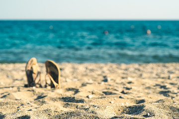 summer background with flip flops on a sandy beach - 278636506