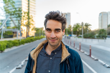 Portrait of smiling casual man in the city, Barcelona, Spain