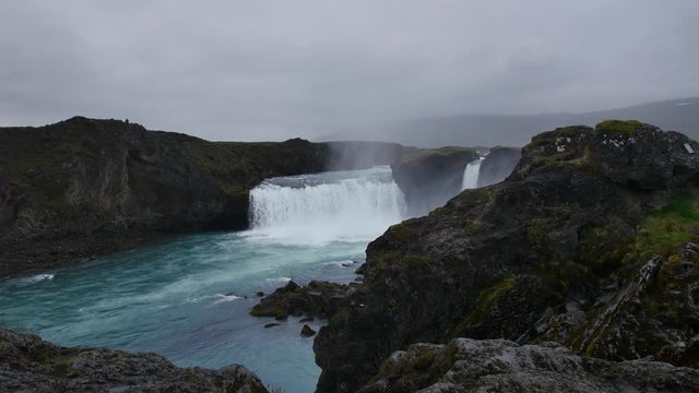 Godafoss waterfall on cloudy, rainy day, Iceland.