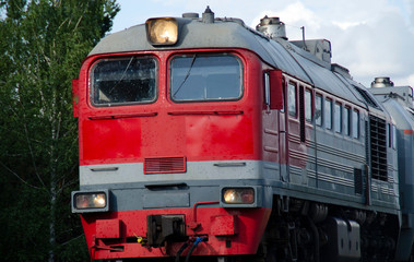 Red-gray passenger long-distance train close-up. Russian Railways.