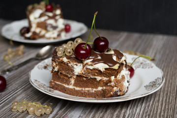 two pieces of chocolate cake with a cherry