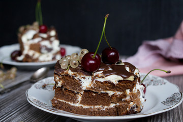 two pieces of chocolate cake with a cherry