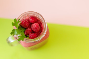 smoothies with raspberries on a colored background. selective focus. 