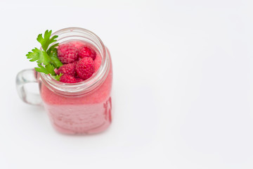 smoothies with raspberries on white background