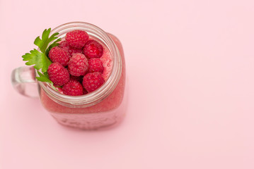 raspberry smoothie on pink background