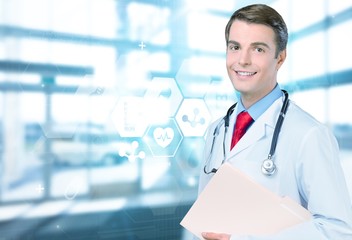 Handsome doctor portrait on background