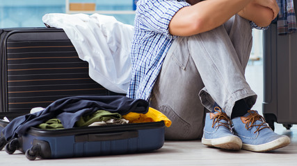 Young man preparing for vacation travel