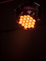 stage light with orange color hue