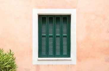 Fototapeta na wymiar Old and colorful window, Italian architecture