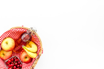 picnic in summer with products, fruits, drinks and hat on white background top view space for text