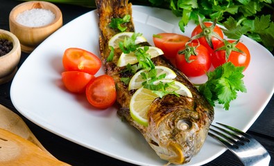 Fried fish served on the plate