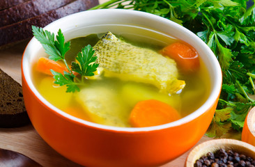 Fish soup served on the table in plate