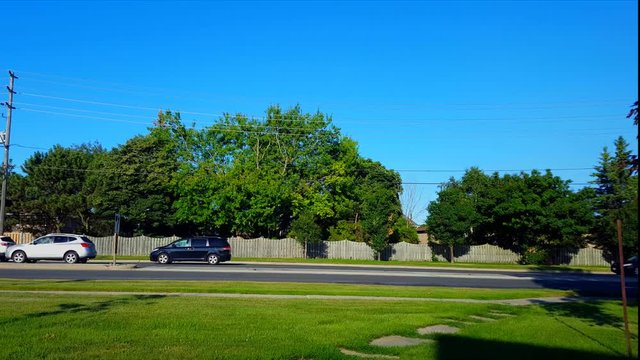 Side View of City Traffic Jam.  Urban Landscape With Car Vehicles Slowing Down to Stop in Summer Day.