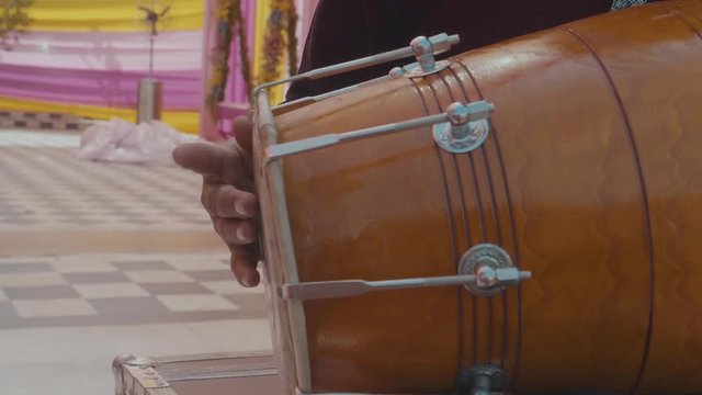 Slow Motion Close Up Hands Playing A Traditional Indian Double Sided Drum