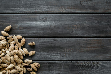 Healthy snack with almonds on wooden background top view mock up