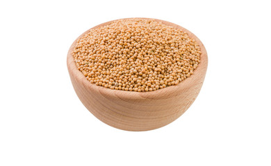 white mustard in wooden bowl isolated on white background. 45 degree view. Spices and food ingredients.