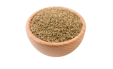 anise seeds in wooden bowl isolated on white background. 45 degree view. Spices and food ingredients.