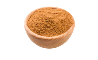 milled or ground nutmeg in wooden bowl isolated on white background. 45 degree view. Spices and food ingredients.