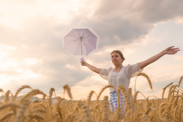 Girl  in a field of wheat