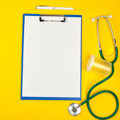 empty white sheets and medical stethoscope