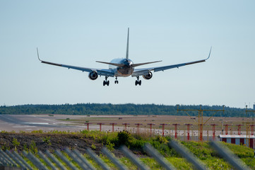Landing airplane silhouette on final approach at EFHK