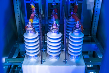 Electrical panel with porcelain insulators. Insulating material. Electrical insulating ceramics. The electro-ceramics. Insulators for high voltage. High voltage power supply. Electrical industry.