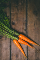Fresh tasty carrots on a wooden rustic table. Healthy food. Vegetables.