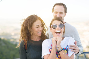 Family of three smiling cheerful having fun outdoors