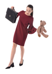 Balancing businesswoman with briefcase and toy on white background