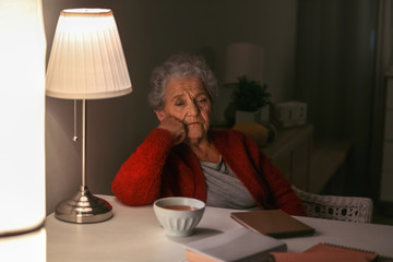 Senior woman suffering from insomnia at night