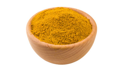 yellow curry in wooden bowl isolated on white background. 45 degree view. Spices and food...