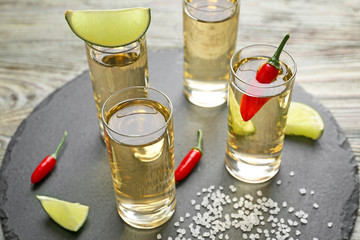 Shots of tequila on slate plate
