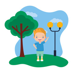 Obraz na płótnie Canvas happy boy standing in the park