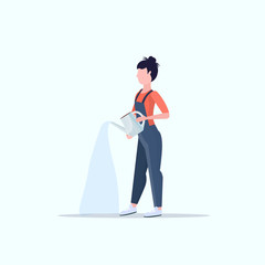 Female farmer holding watering can gardener