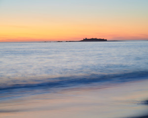 Fototapeta premium Sunset at the Moledo beach, with a mountain on backgroud