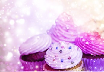 Tasty Colorful cupcakes on background