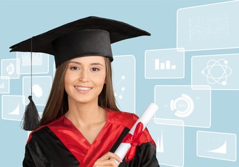 Portrait of confident female student in graduation gown showing certificate against white background. Vertical shot.